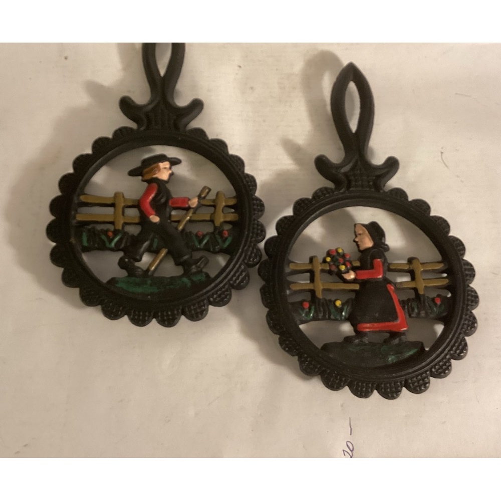 Pair of cast iron Amish trivets
